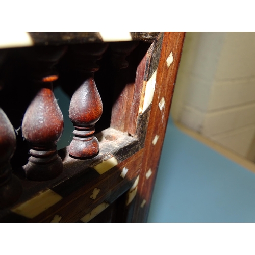 47 - An Anglo-Indian hardwood octagonal folding table inlaid overall with ivory, ebony and bone, the stan... 