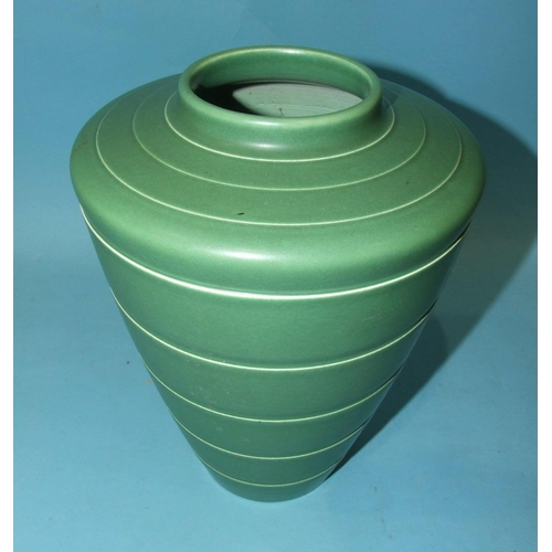 88 - A Keith Murray Wedgwood studio pottery green-glazed shoulder vase with ribbed decoration, shape no.3... 