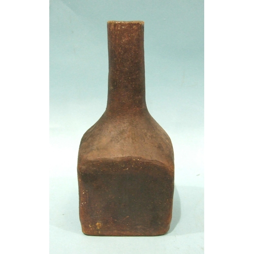 90 - A heavy stoneware bottle of square form with slender neck, 20.5cm high.