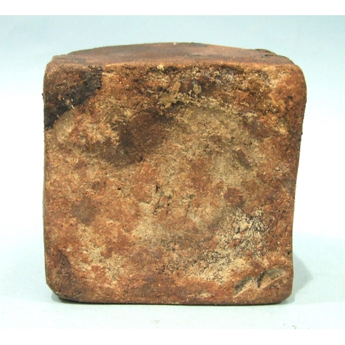 90 - A heavy stoneware bottle of square form with slender neck, 20.5cm high.