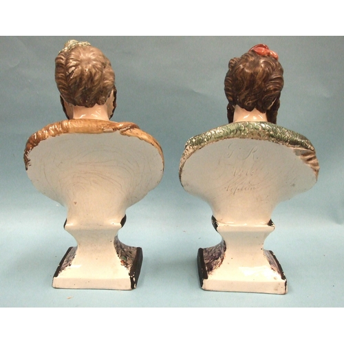 93 - A pair of 19th century pearlware painted busts depicting Neptune and Hercules, on marble-effect base... 