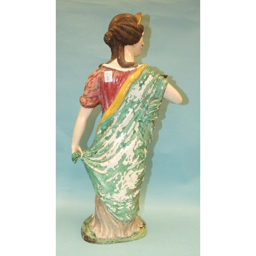 94 - A large 19th century Staffordshire glazed earthenware figure of a Greek goddess with a bird perched ... 