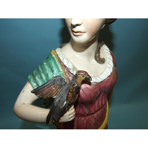 94 - A large 19th century Staffordshire glazed earthenware figure of a Greek goddess with a bird perched ... 