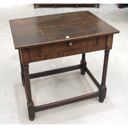 36 - An antique oak side table, the rectangular top above a frieze with drawer, on turned legs joined by ... 