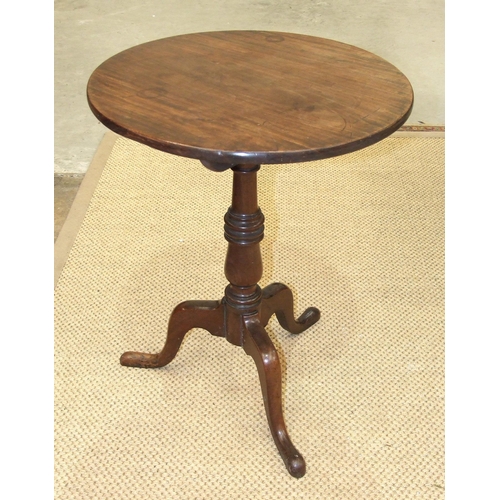 38 - An 18th century mahogany tripod table, the circular top on turned column and tripod supports, 55cm d... 