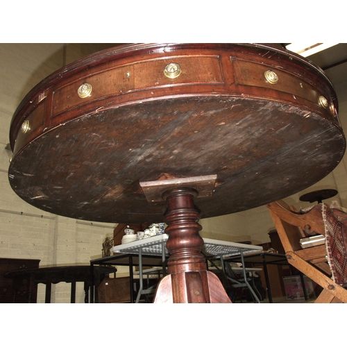 42 - An early-19th century mahogany drum table, the top with replacement leather surface above four friez... 