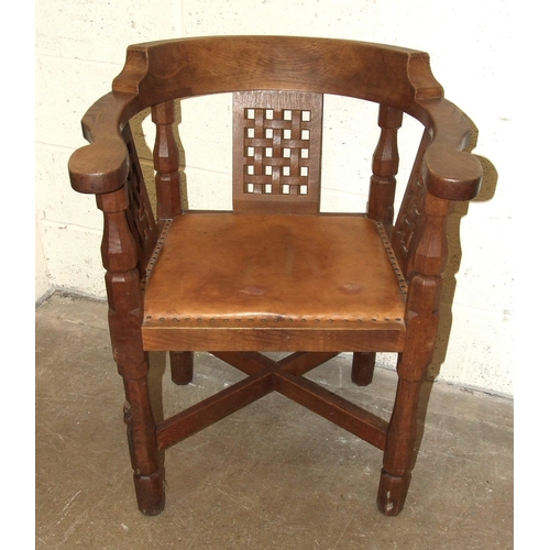 60 - Robert 'Mouseman' Thompson Workshop, an English monk's chair, the curved back and outswept arms abov... 