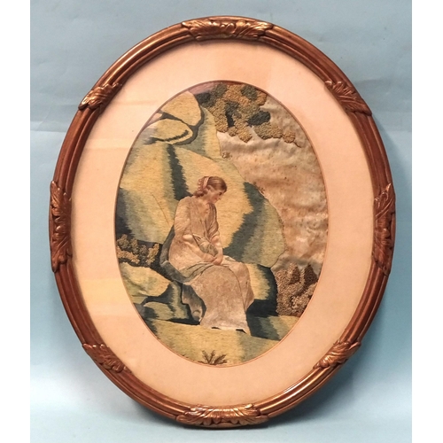 76 - An 18th/19th century oval needlework picture of a woman contemplating in a landscape, 32 x 24cm and ... 