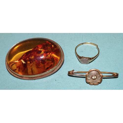 245 - A 9ct gold-mounted amber brooch, 43 x 32mm,  11.6g, a gold ring set 8/8-cut diamond points, 1.5g, (a... 