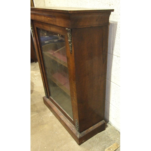 41 - A Victorian inlaid walnut dwarf display cabinet, having a single glazed door and gilt metal mounts, ... 