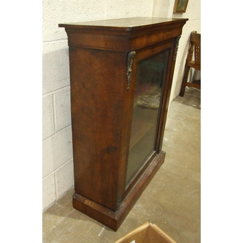 41 - A Victorian inlaid walnut dwarf display cabinet, having a single glazed door and gilt metal mounts, ... 