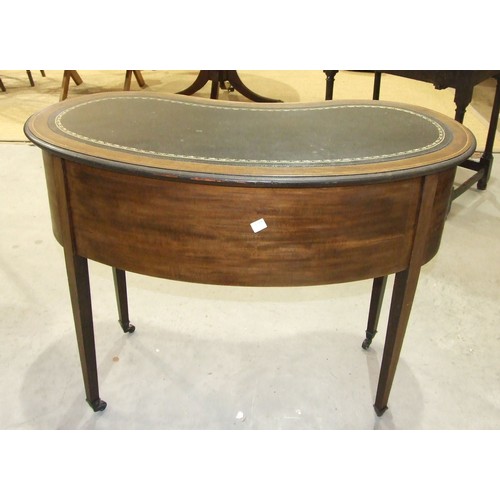 58 - A small Edwardian kidney-shaped writing table, the top inlaid with writing surface above a centre an... 