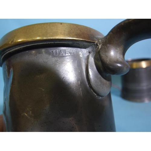 108 - Three graduated pewter and brass-rimmed measures with ER and GR marks, 14cm, 10.5cm and 8cm high and... 