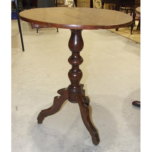 50 - An antique oak country circular tripod table on turned column and shaped legs, 53cm diameter and a l... 