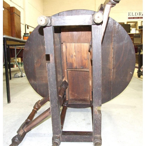 52 - A smaller antique oak oval gate-leg table on turned legs joined by stretchers, 92 x 104cm open.... 