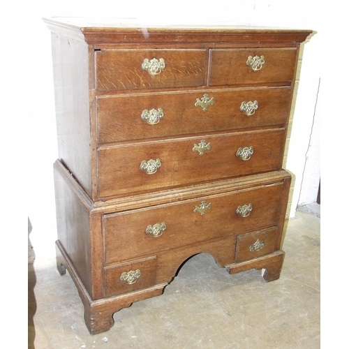 63 - An 18th century oak chest on stand fitted with seven drawers, 97.5cm wide, 121cm high, (altered and ... 