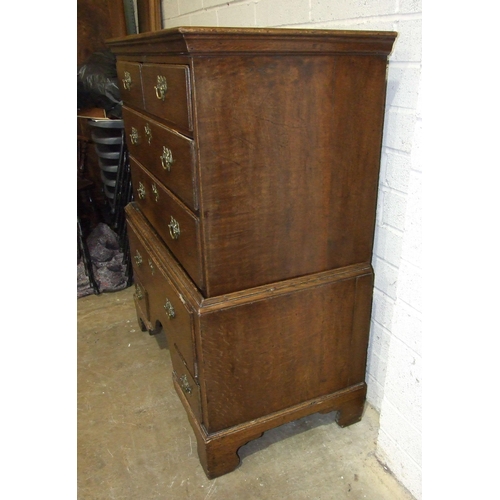 63 - An 18th century oak chest on stand fitted with seven drawers, 97.5cm wide, 121cm high, (altered and ... 