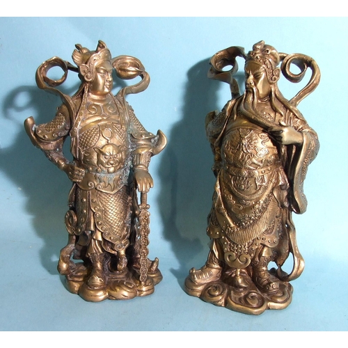 74 - A pair of early-20th century brass figures of Chinese warriors, 24cm high.