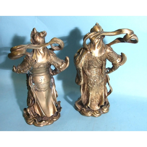 74 - A pair of early-20th century brass figures of Chinese warriors, 24cm high.