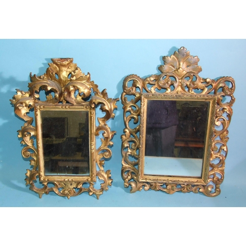 77 - Two 19th century giltwood-framed wall mirrors, each with pierced scrolling foliate frame enclosing a... 