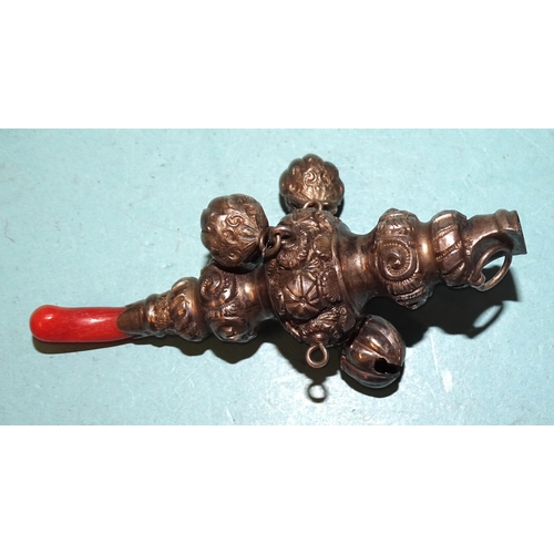 351 - A Victorian baby's rattle and whistle hung with three bells, (one missing) and having a coral teethe... 