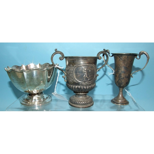 433 - A George V silver two-handled trophy cup decorated in relief with two golfers within oval plaques an... 