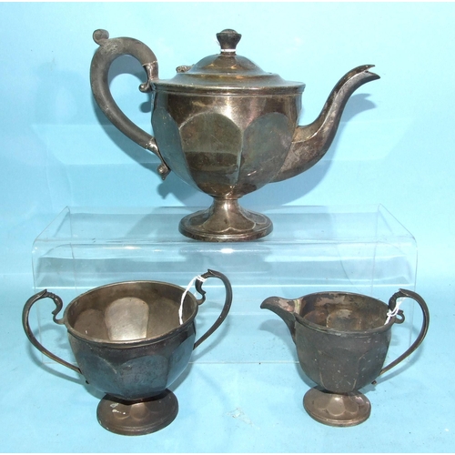 444 - A George V silver three-piece tea service of circular lobed form, comprising teapot, sugar bowl, cre... 