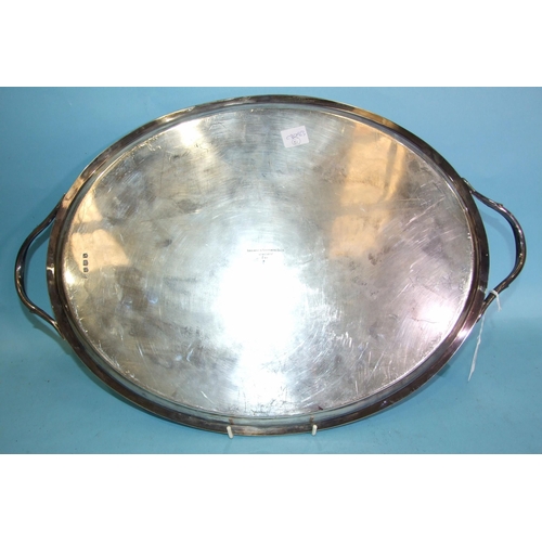 461 - A George V silver oval two-handled tray with reeded rim and handles, 55 x 35cm, Sheffield 1919, make... 