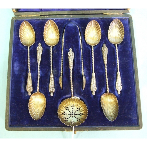 474 - An Edwardian cased set of six apostle coffee spoons with fluted bowls, matching sugar tongs and sift... 