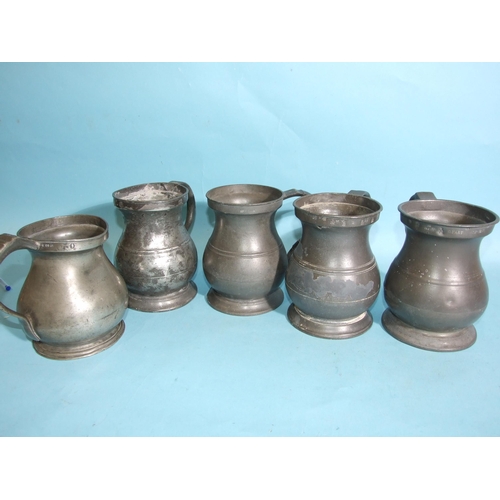 114 - Five pewter quart measures and four pint measures, all of baluster shape and bearing VR, GR and ER c... 