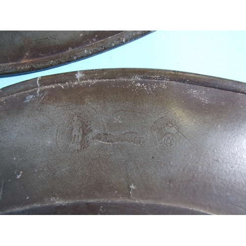 117 - A pair of large pewter chargers marked John Lawrence, 52cm diameter, marked to underside and another... 