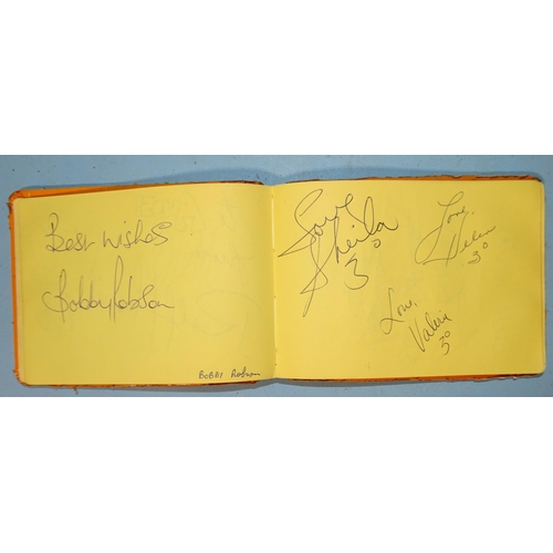 175 - A small autograph book containing autographs of George Best, Kevin Keegan, Ron Greenwood, Kenny Dalg... 