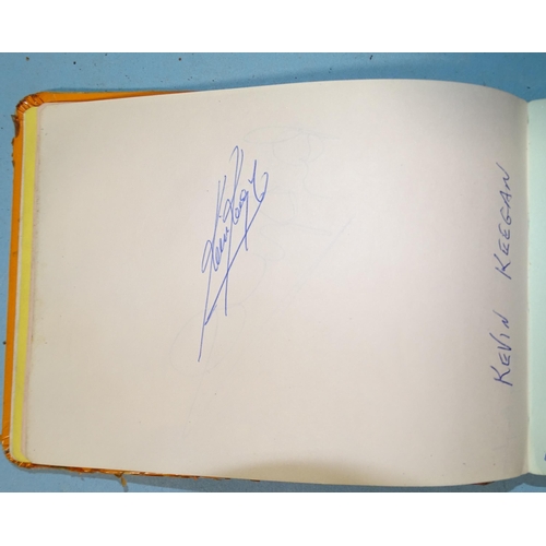 175 - A small autograph book containing autographs of George Best, Kevin Keegan, Ron Greenwood, Kenny Dalg... 