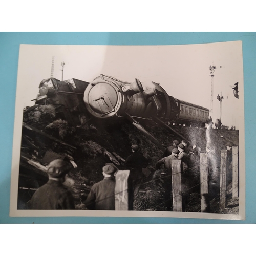 185 - Seven 1930's press photographs, six of which show a derailment of a locomotive, coaches and wagons a... 