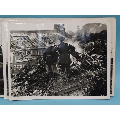 185 - Seven 1930's press photographs, six of which show a derailment of a locomotive, coaches and wagons a... 