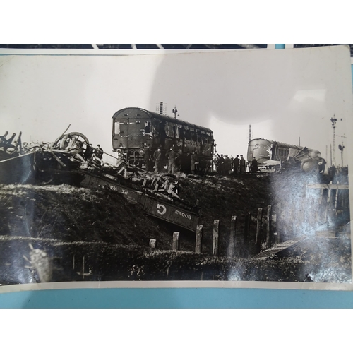 185 - Seven 1930's press photographs, six of which show a derailment of a locomotive, coaches and wagons a... 