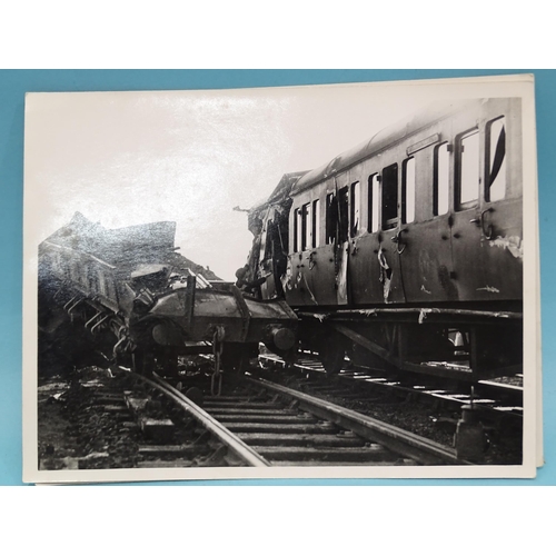 185 - Seven 1930's press photographs, six of which show a derailment of a locomotive, coaches and wagons a... 