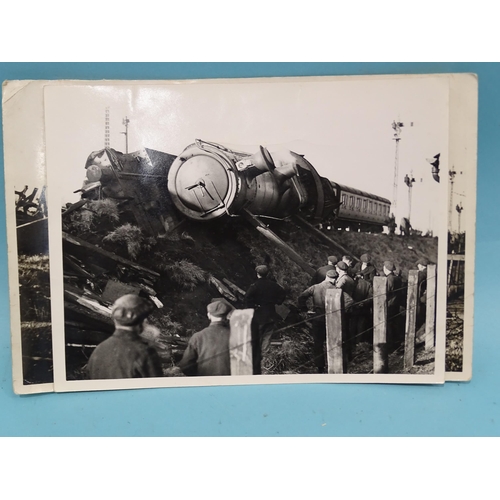 185 - Seven 1930's press photographs, six of which show a derailment of a locomotive, coaches and wagons a... 