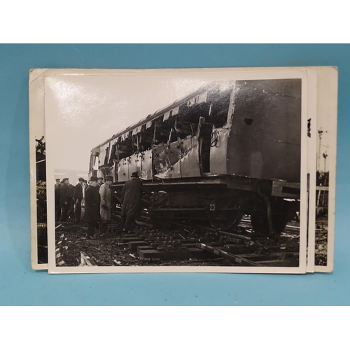 185 - Seven 1930's press photographs, six of which show a derailment of a locomotive, coaches and wagons a... 