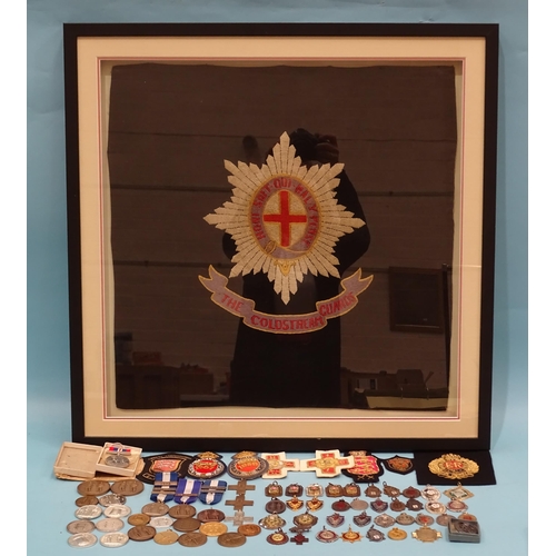 202 - A glazed embroidered panel for the Coldstream Guards, a War Medal 1938-45, in box of issue, eight bu... 