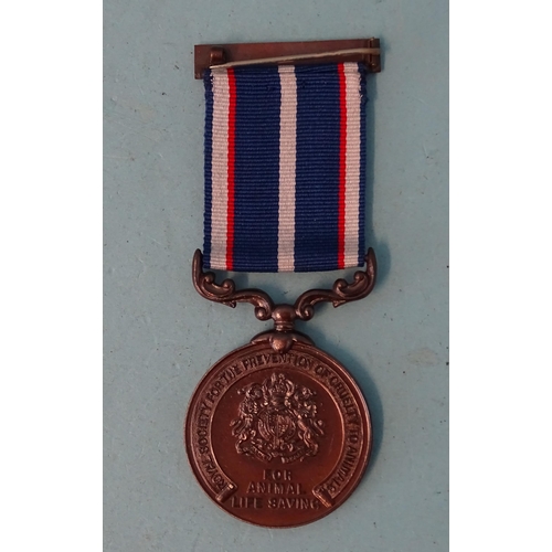 210 - An RSPCA bronze medal for animal life saving awarded to Charles E. Crossman, 1945, with 