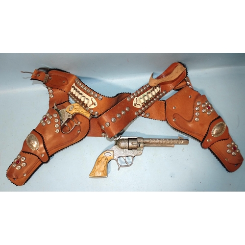 271 - A pair of Halco US Marshal 44 cap guns, in leather double-holster with bullets.