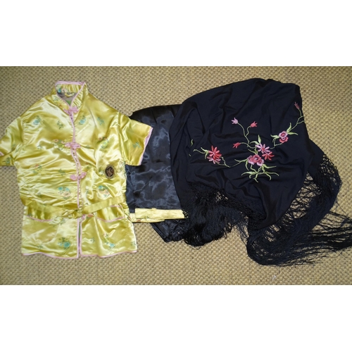 302 - A pair of Chinese brocade pyjamas and an embroidered black silk fringed shawl, 90 x 95cm excluding f... 