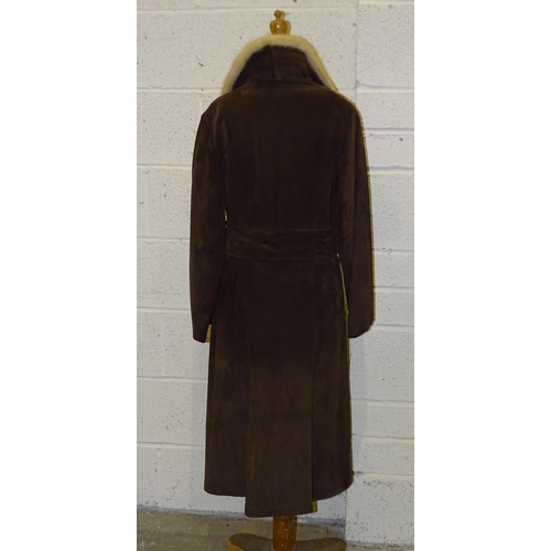 305 - A lady's long brown suede double-breasted coat, belted, with honey-coloured fur collar and lapels, s... 