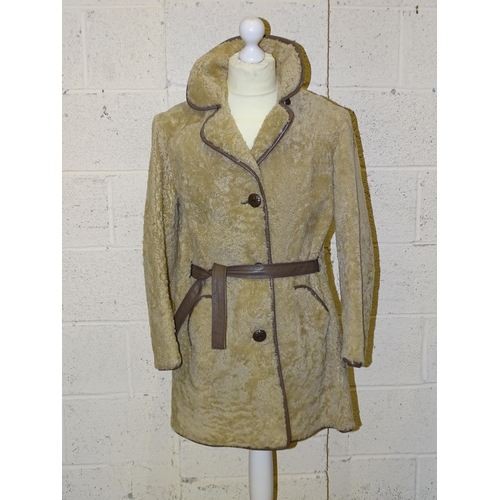 305 - A lady's long brown suede double-breasted coat, belted, with honey-coloured fur collar and lapels, s... 