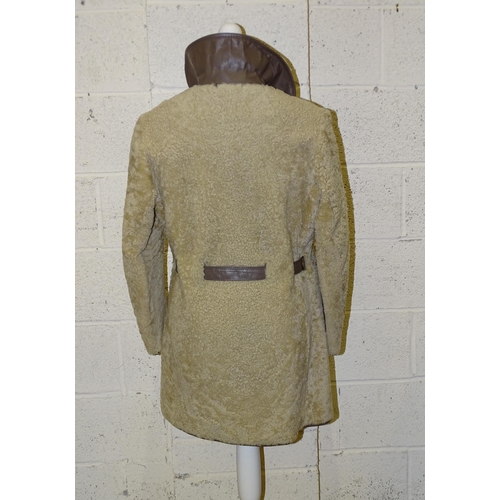 305 - A lady's long brown suede double-breasted coat, belted, with honey-coloured fur collar and lapels, s... 