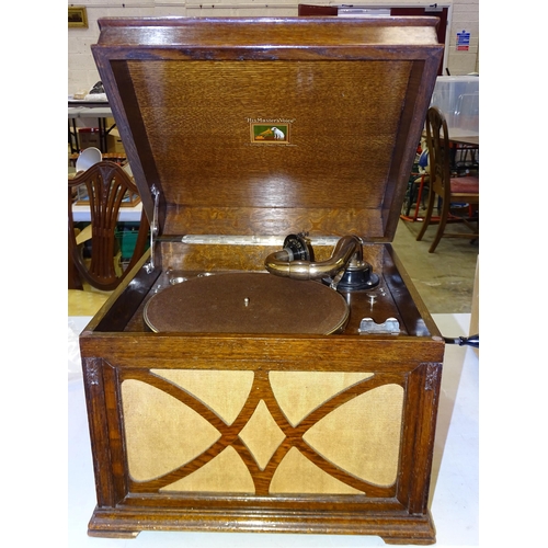 322 - An HMV oak-cased table-top gramophone, spring-intact turntable operates, 45cm wide, 37cm high.... 