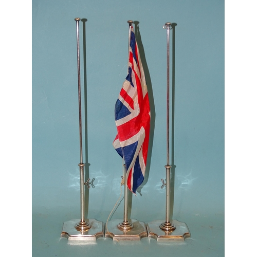 325 - Three silver-plated conference table flag poles, 40cm high, two with Union flag, one with French fla... 