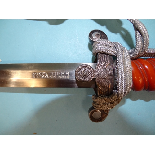 335 - Lauterjung & Co, a WWII German army officer's dagger with orange celluloid grip, pommel with oak... 