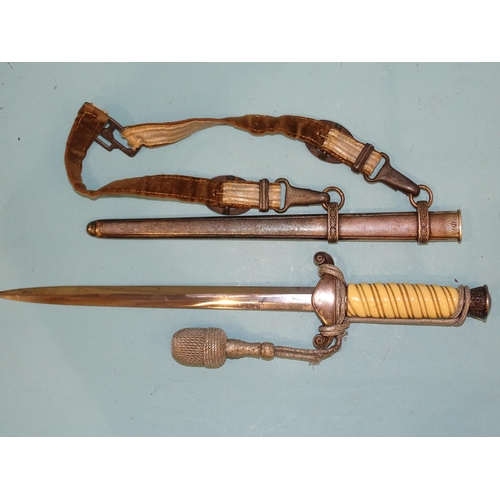 342 - A WWII German army officer's dagger with white celluloid grip, pommel with oak leaves relief, cross ... 